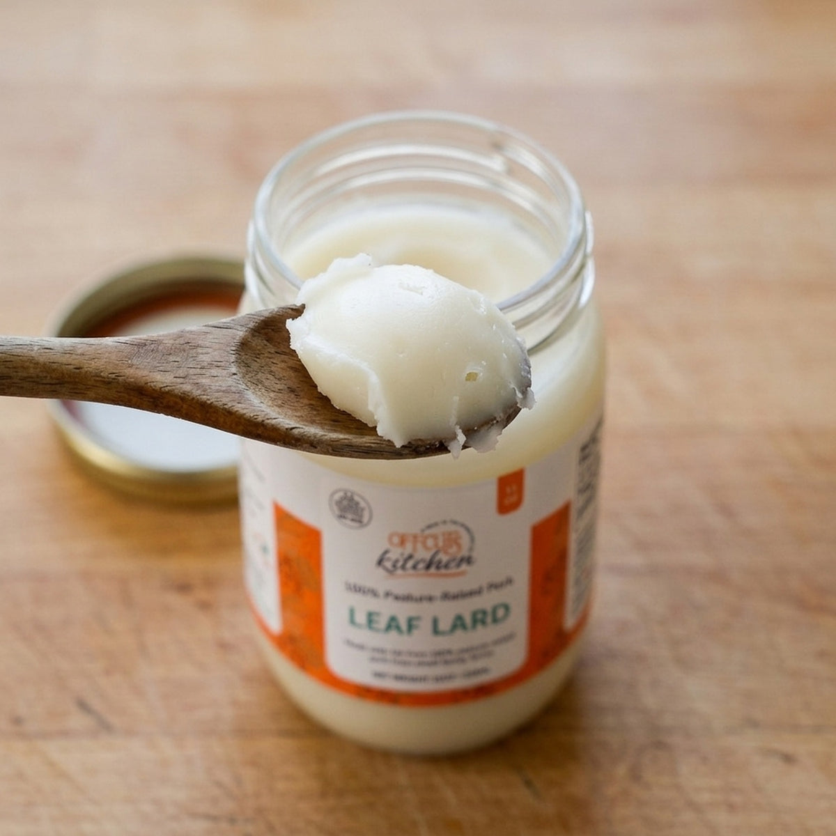 Spoonful of Offcuts Kitchen pasture-raised leaf lard lifted from the open 11 oz jar