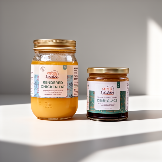 Two jars of 'Chef's Kitchen' rendered chicken fat and demi-glace on a white surface with a gray background.