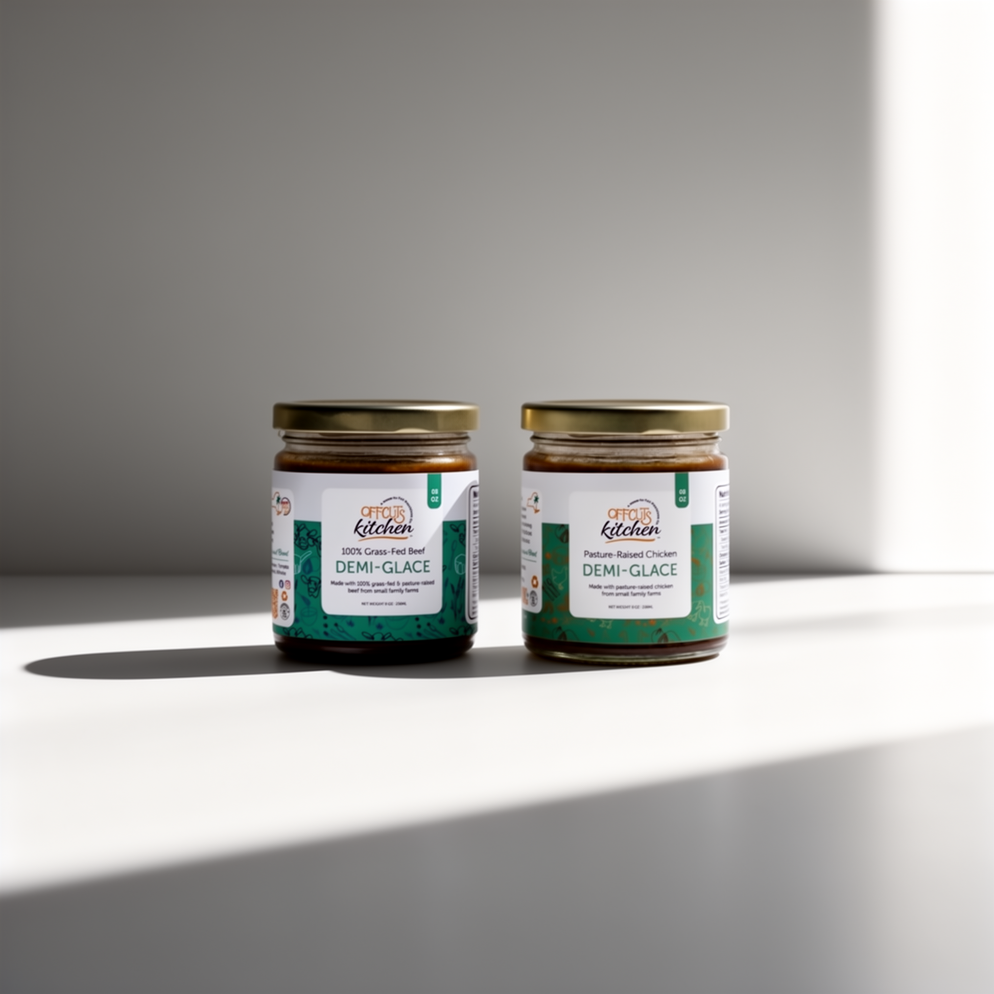 Two jars of 'Offcuts Kitchen' demi-glace on a white surface with a gray background